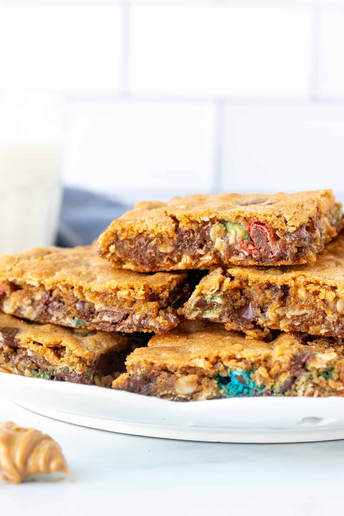 Plate of gooey peanut butter oatmeal cookie bars, piled on top of each other