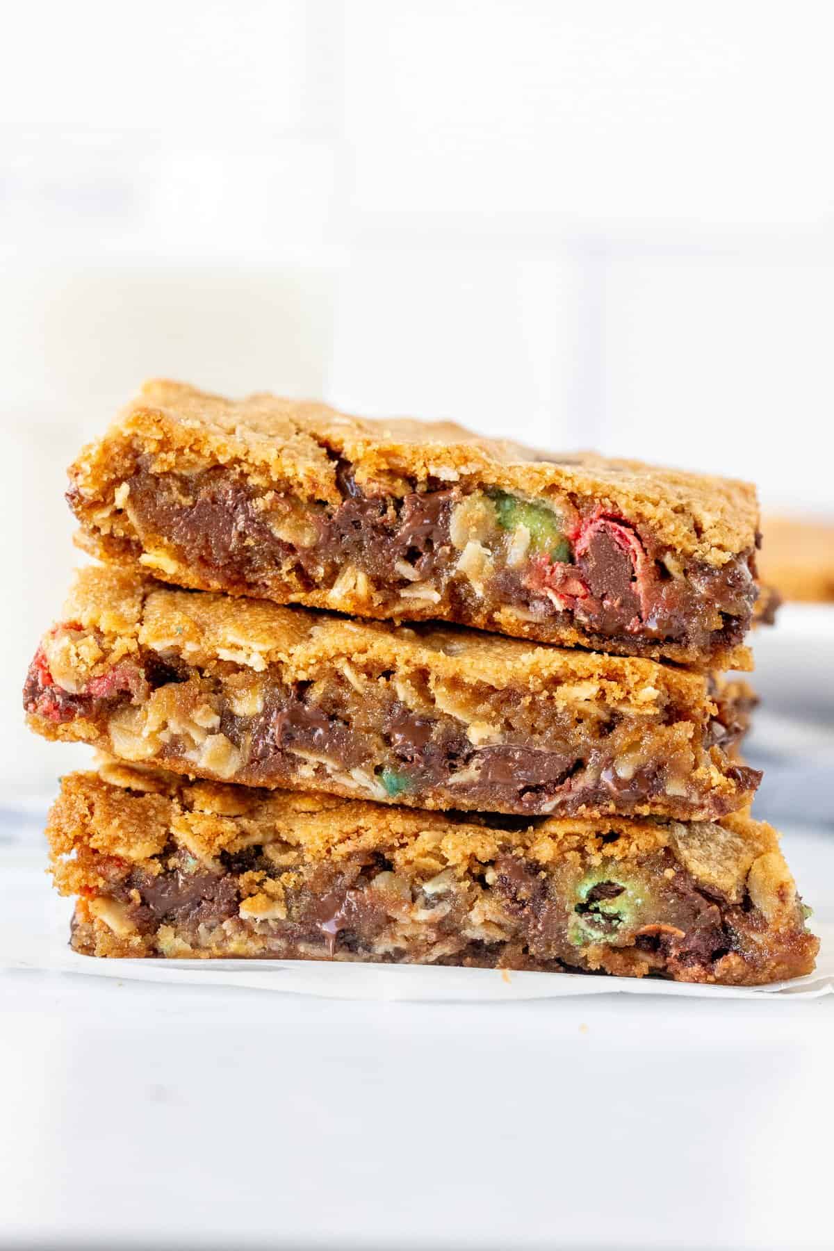 Stack of three monster cookie bars, one on top of each other
