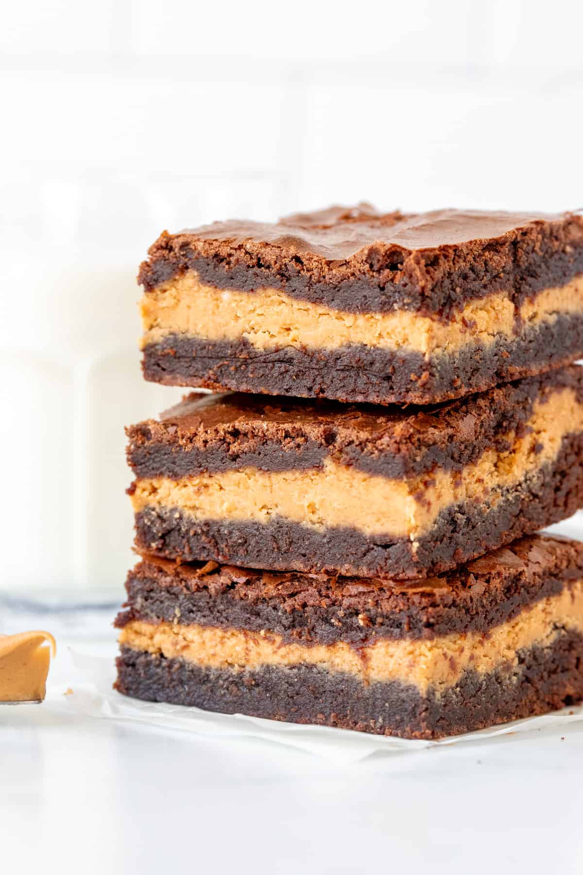 Three peanut butter stuffed brownies, one on top of each other