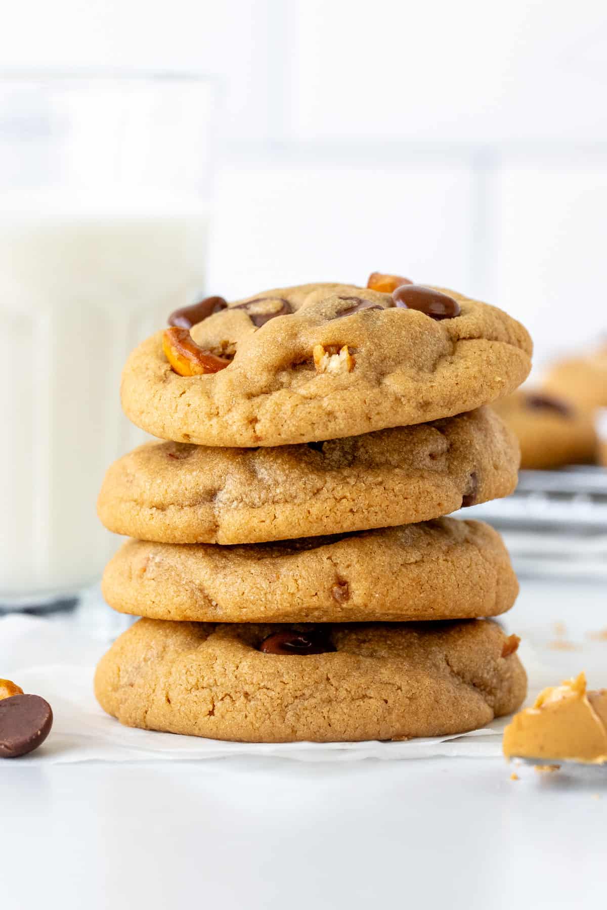 Stack of four thick peanut butter pretzel chocolate chip cookies