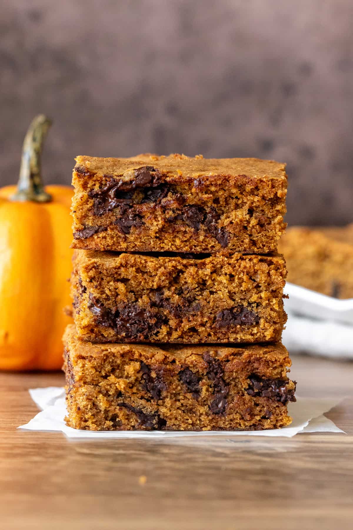Three pumpkin cookie bars, one on top of the other.