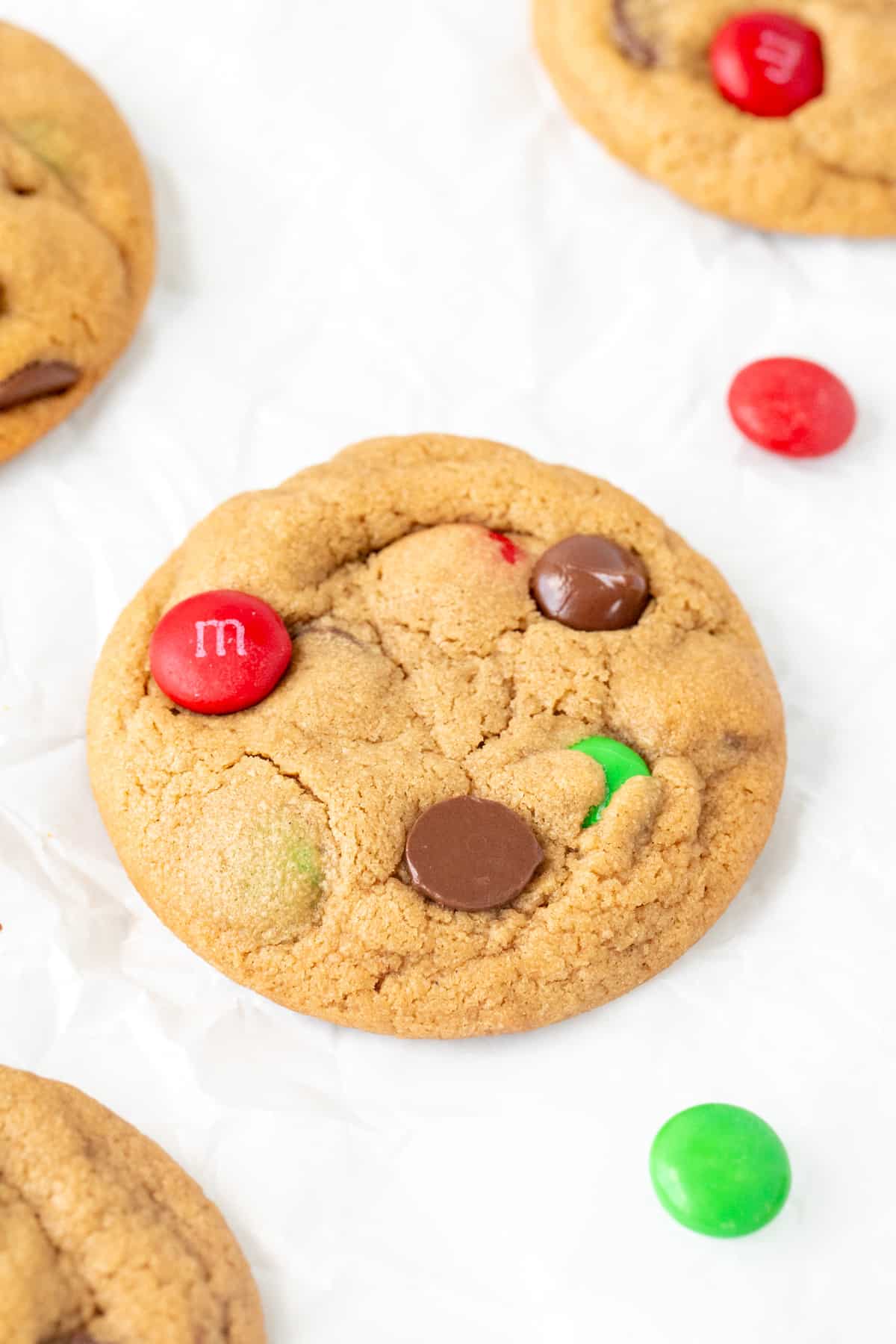 Peanut butter cookie with holiday M&Ms and chocolate chips