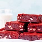 Plate of red velvet brownies filled with white chocolate chips