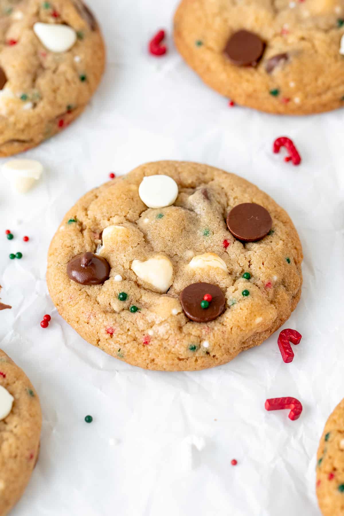 Chocolate chip cookie with white chocolate chips and chocolate chips and red and green sprinkles