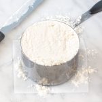 Dry measuring cup of flour