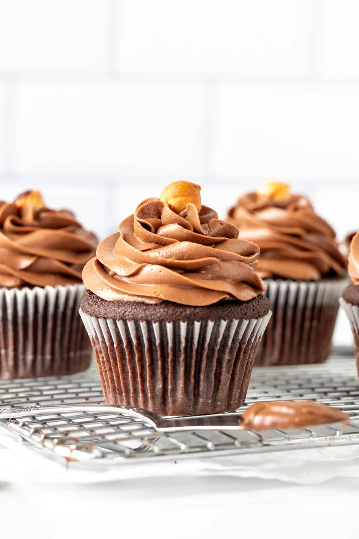 Chocolate cupcakes piped with creamy Nutella buttercream frosting