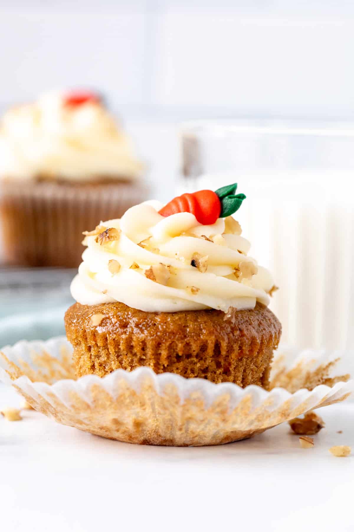 Carrot cake cupcake with muffin paper peeled back