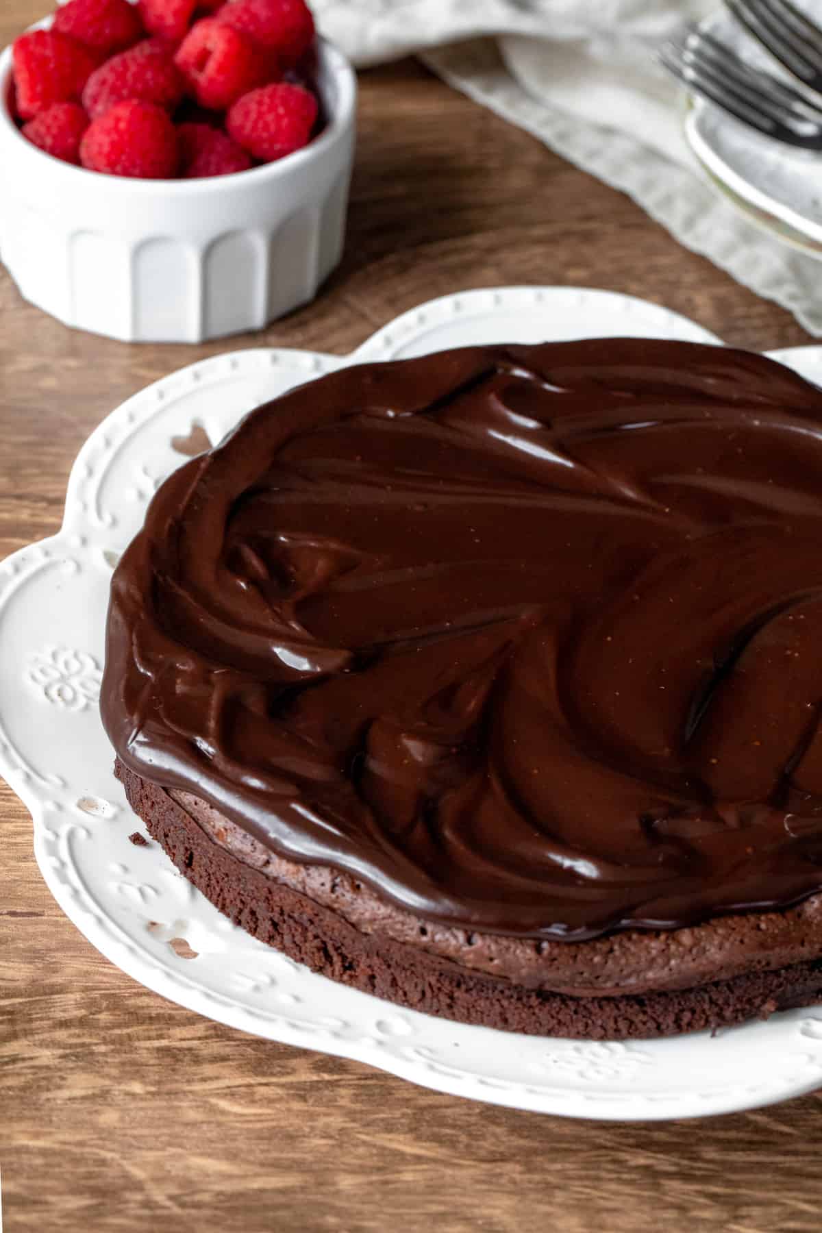 8-inch round flourless chocolate cake with chocolate ganache on top