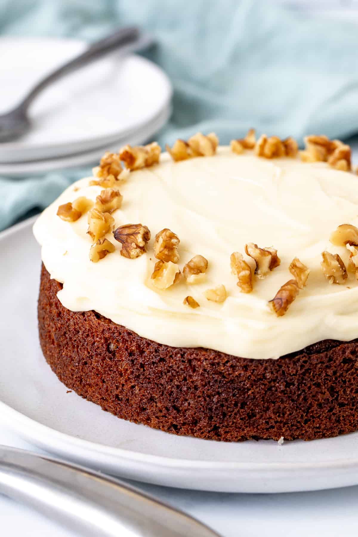 6-inch round mini carrot cake with cream cheese frosting and walnuts around the edges