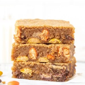 Stack of three peanut butter blondies, one on top of each other