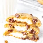 Cream cheese stuffed cookies, broken in half and stacked on top of each other