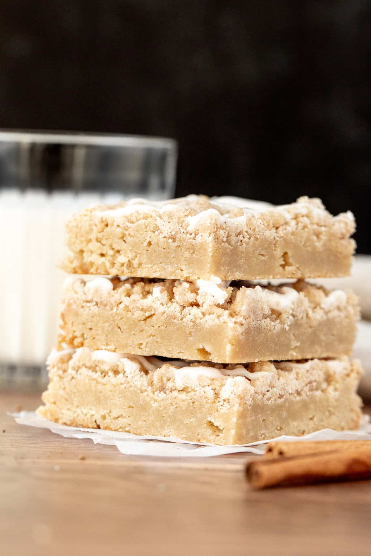 Three blondies topped with cinnamon streusel, stacked on top of one another