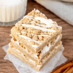 Three coffee cake blondies with glass of milk