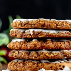 Stack of gingerbread oatmeal cookies with vanilla icing