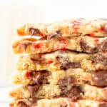 Stack of candy cane chocolate chip cookies, broken in half