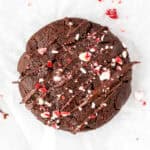 Chocolate peppermint cookie with drizzle of chocolate and crushed candy canes on top