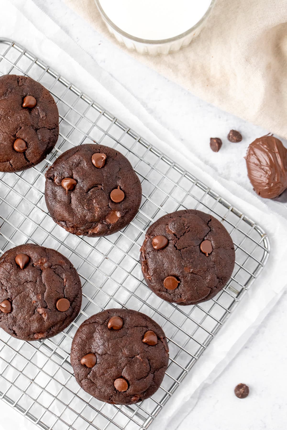 Double chocolate cookies, stuffed with Nutella, on a cooling tray