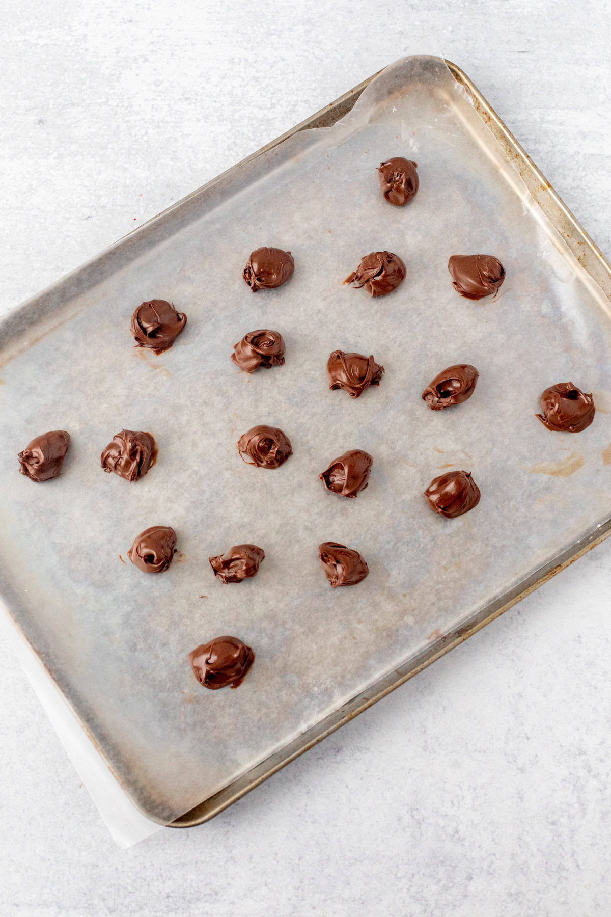 Lined cookie tray with dollops of Nutella