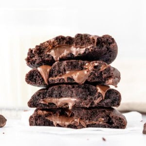 Double chocolate cookies, stuffed with Nutella and broken in half and stacked on top of one another