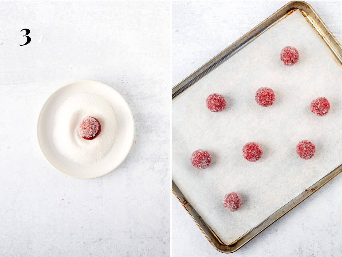 Red velvet cookie dough ball rolled in sugar, and lined cookie sheet with cookie dough balls