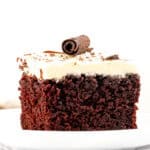 Slice of chocolate cake with white chocolate frosting