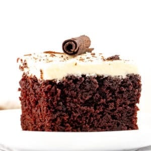 Slice of chocolate cake with white chocolate frosting