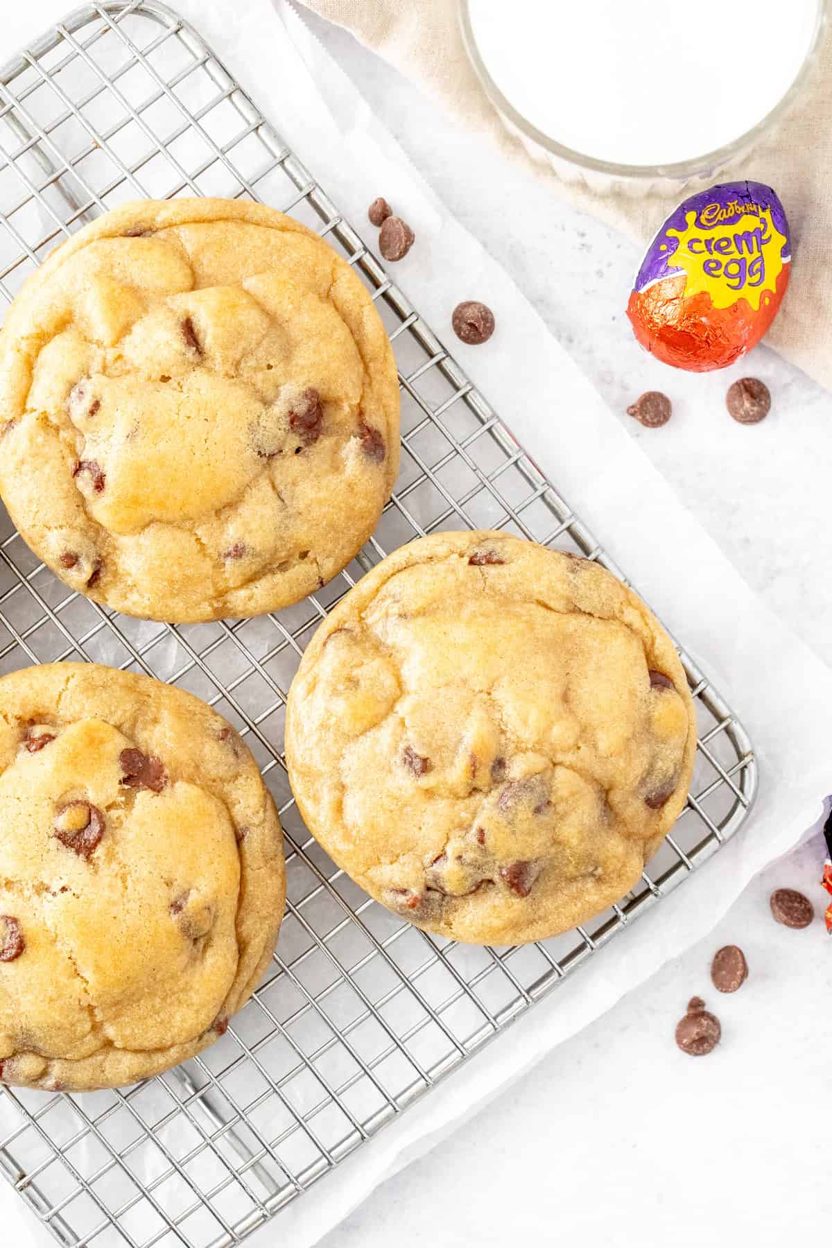 Chocolate chip cookies, stuffed with an Easter egg on a cooling rack