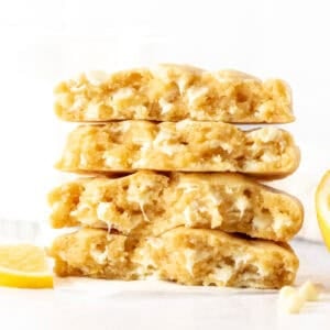 lemon white chocolate chip cookies, broken in half and stacked on top of one another