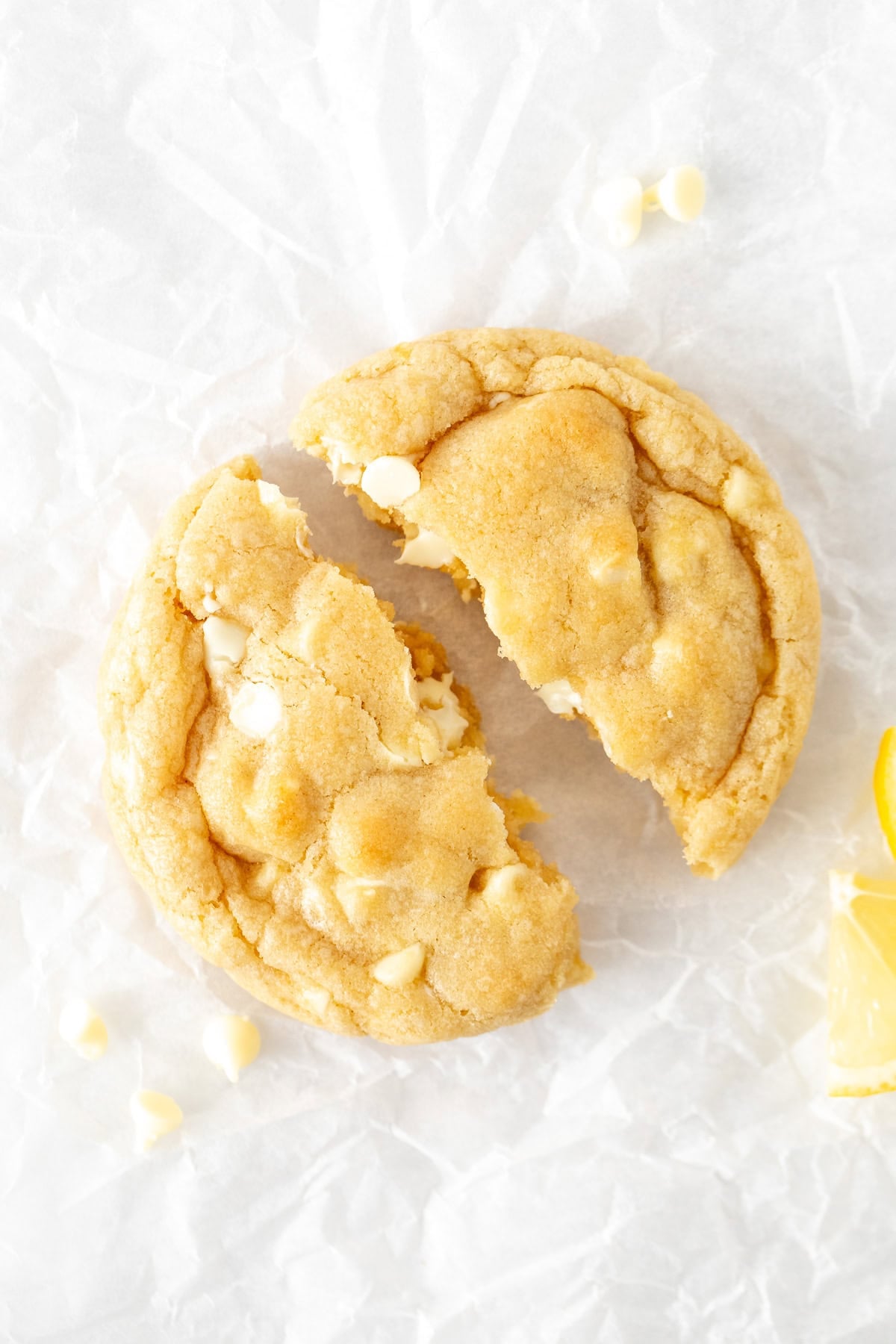 lemon white chocolate chip cookie, broken in half