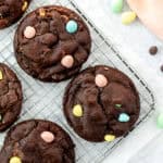 Mini egg chocolate cookies on a cooling rack