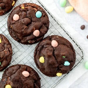 Mini egg chocolate cookies on a cooling rack