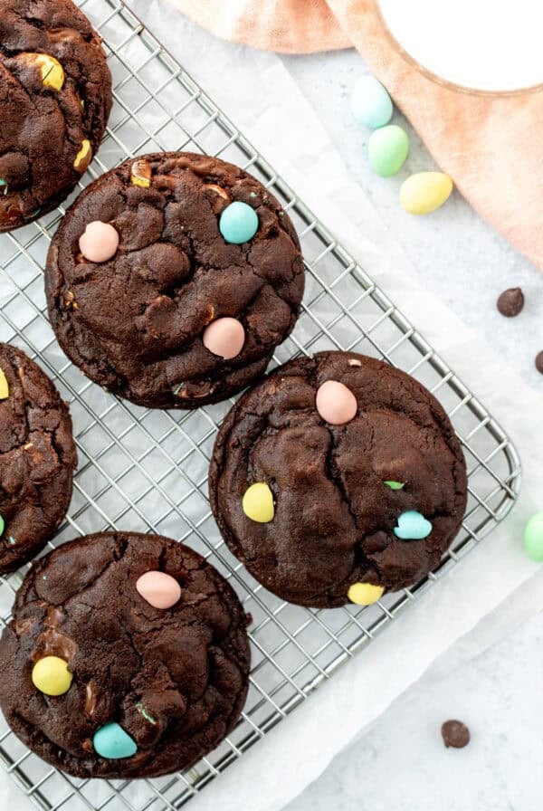 Mini egg chocolate cookies on a cooling rack