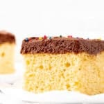 Slice of yellow sheet cake with chocolate frosting