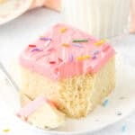 Slice of moist vanilla sheet cake cake with bite taken out