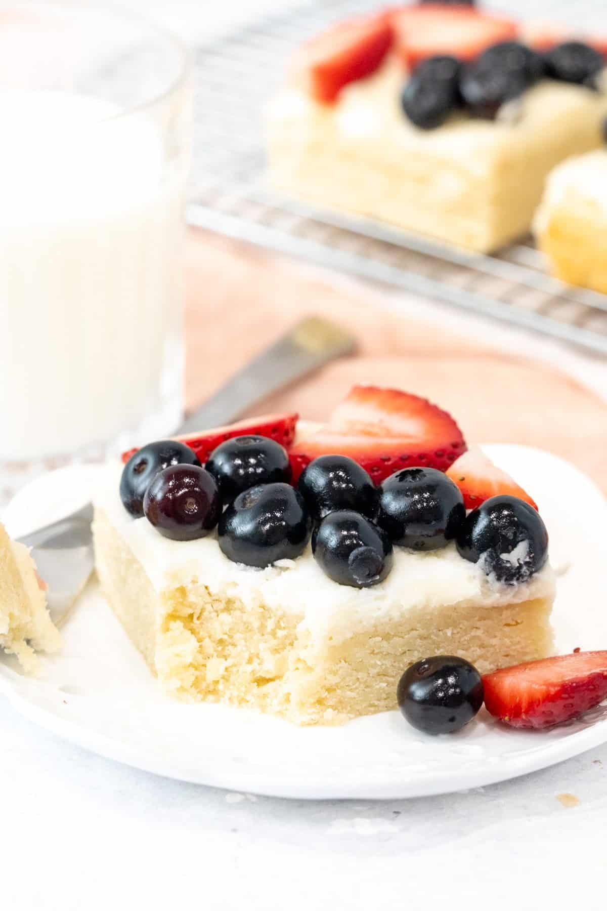 Sugar cookie bar with vanilla frosting and berries on top