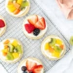 mini fruit pizzas on a wire rack