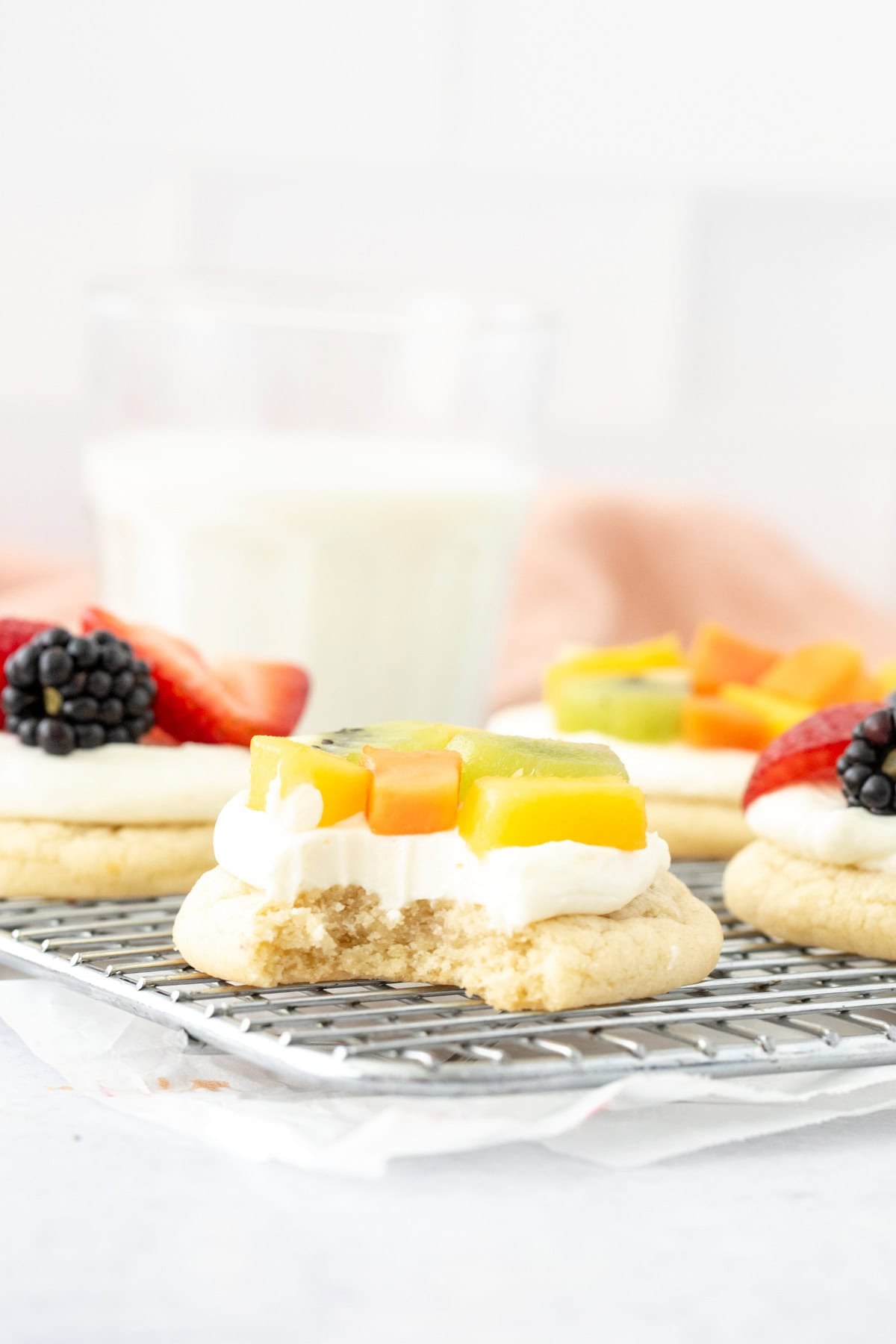 Individual fruit pizza with a bite taken out