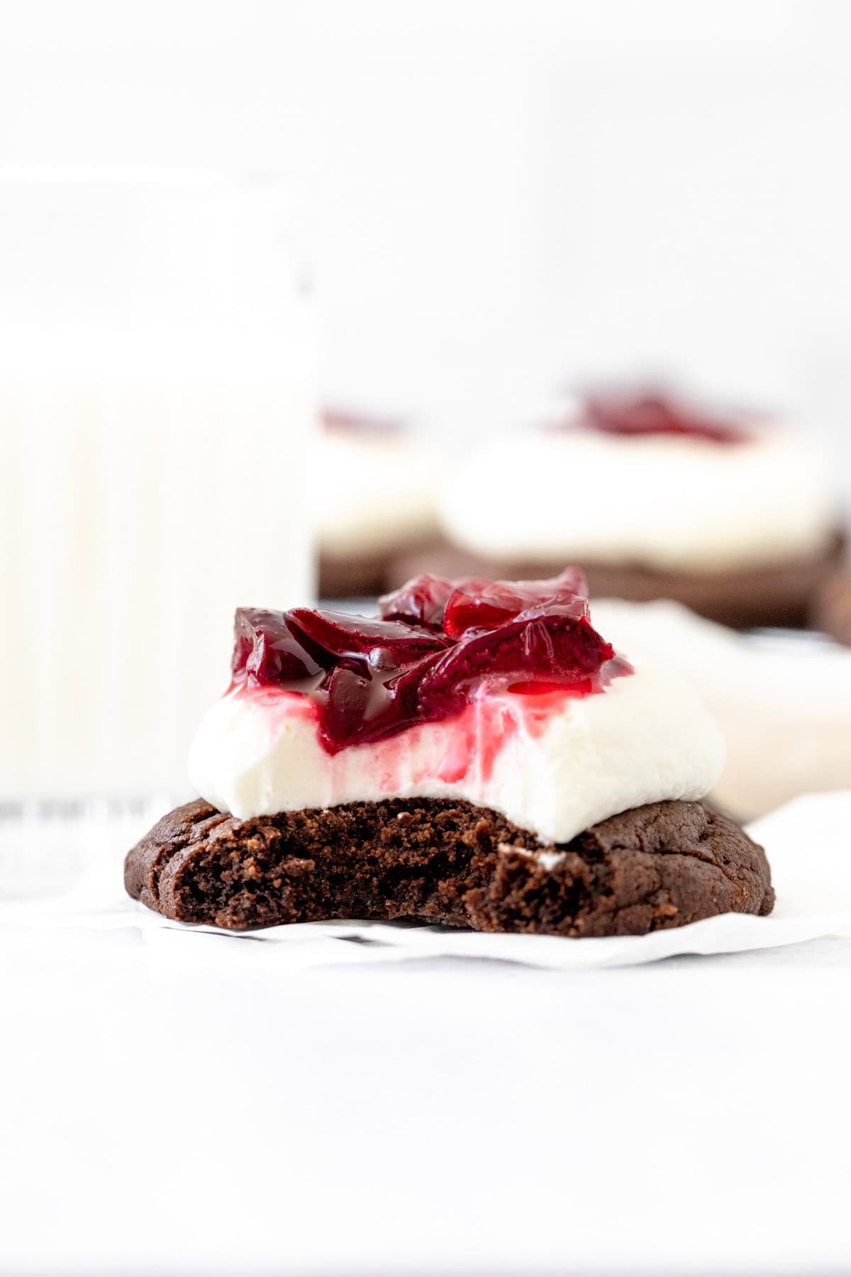 fudgy black forest cookie with a bite taken out