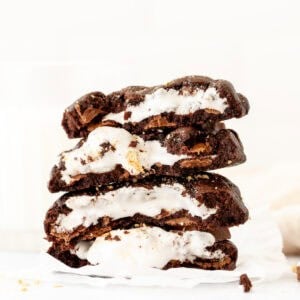 Stack of chocolate s'mores cookies, broken in half