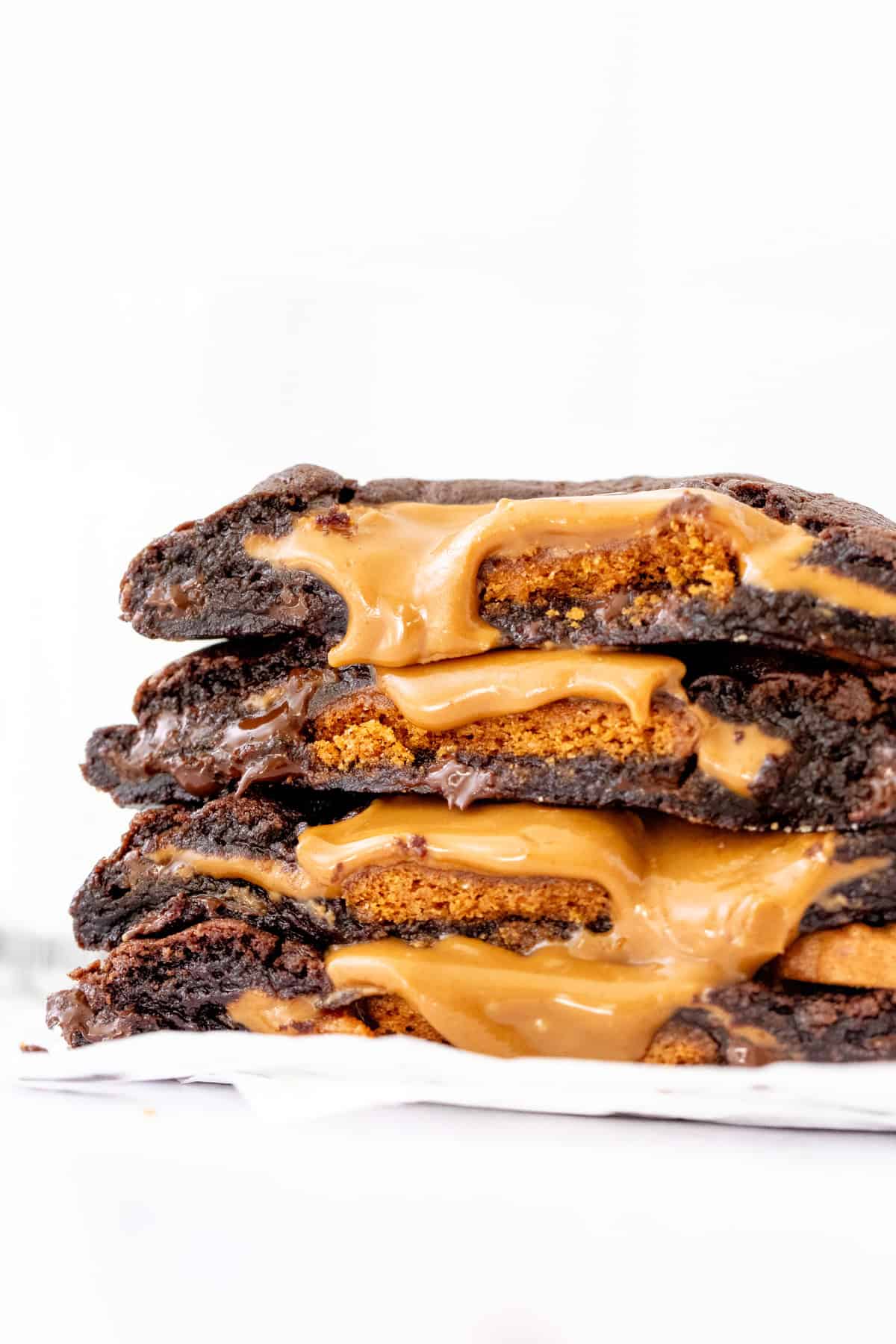 Stack of BIscoff stuffed chocolate cookies broken in half