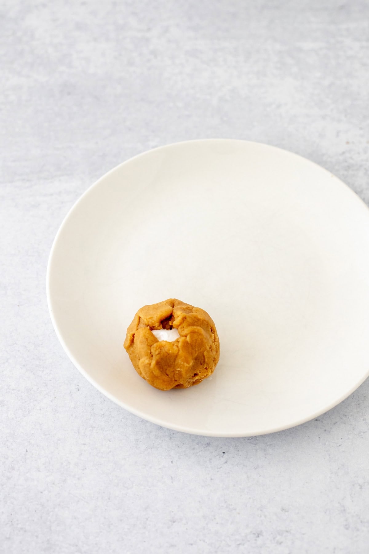 Fluffernutter cookie dough ball on a plate