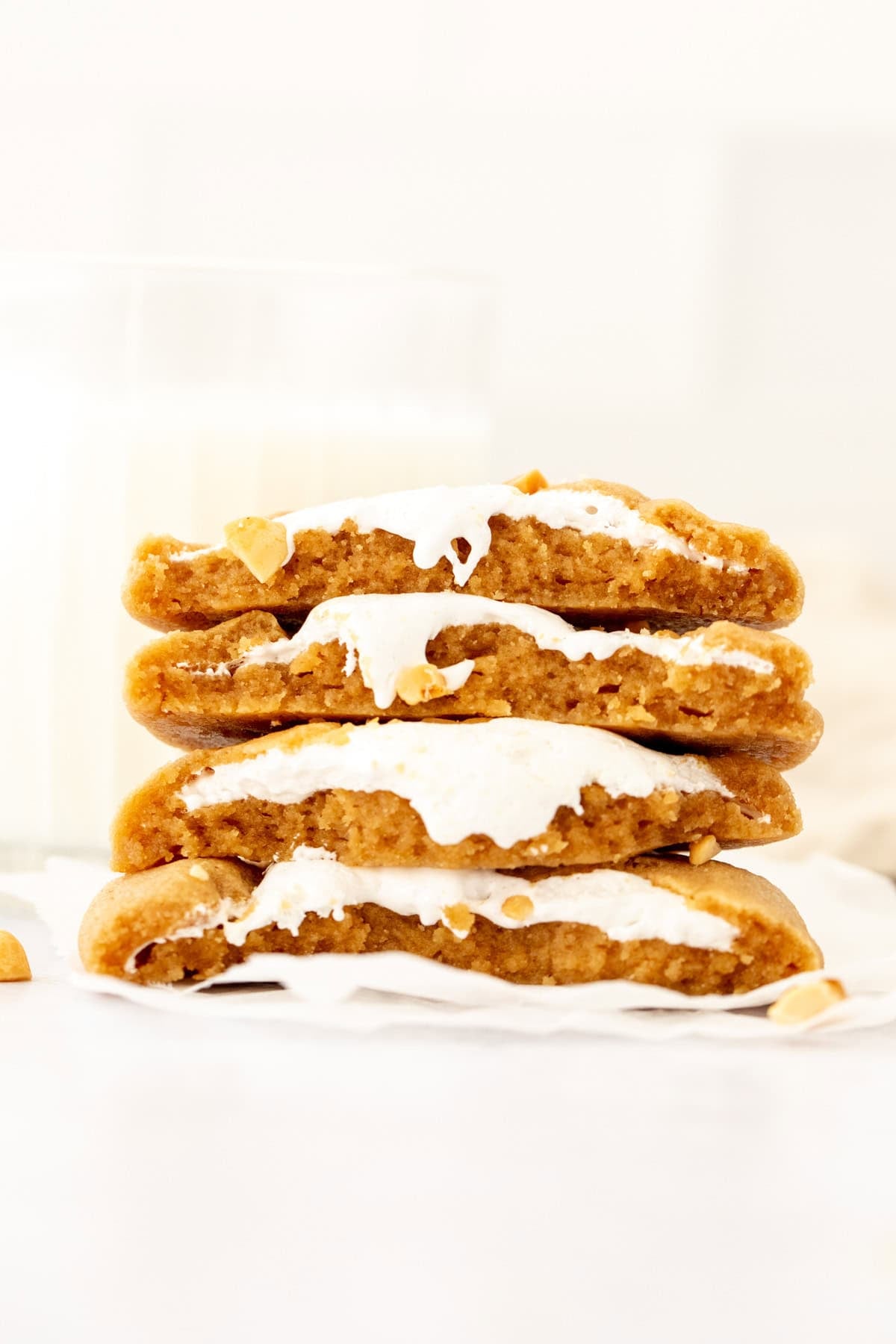 Stack of peanut butter marshmallow cookies broken in half