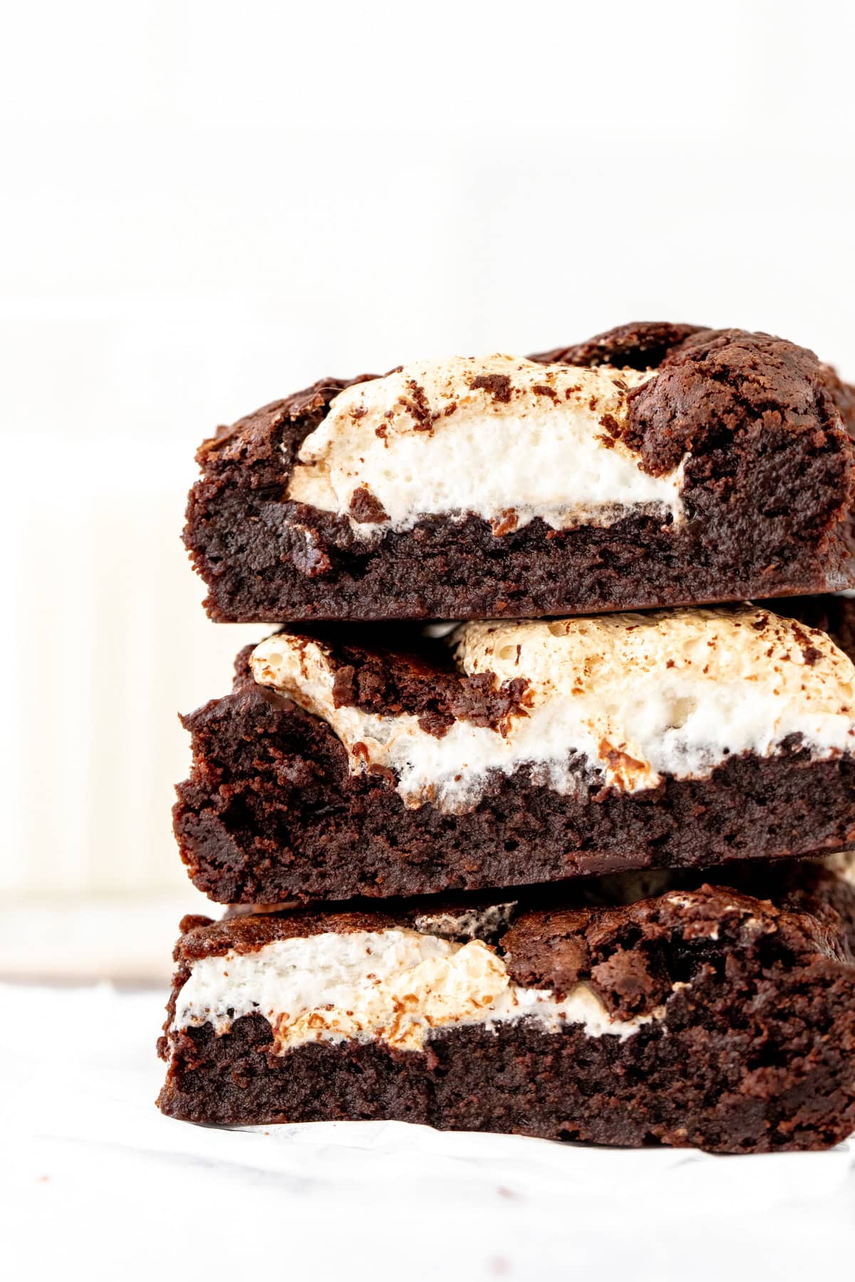 Stack of three brownies with dollops of marshmallow fluff
