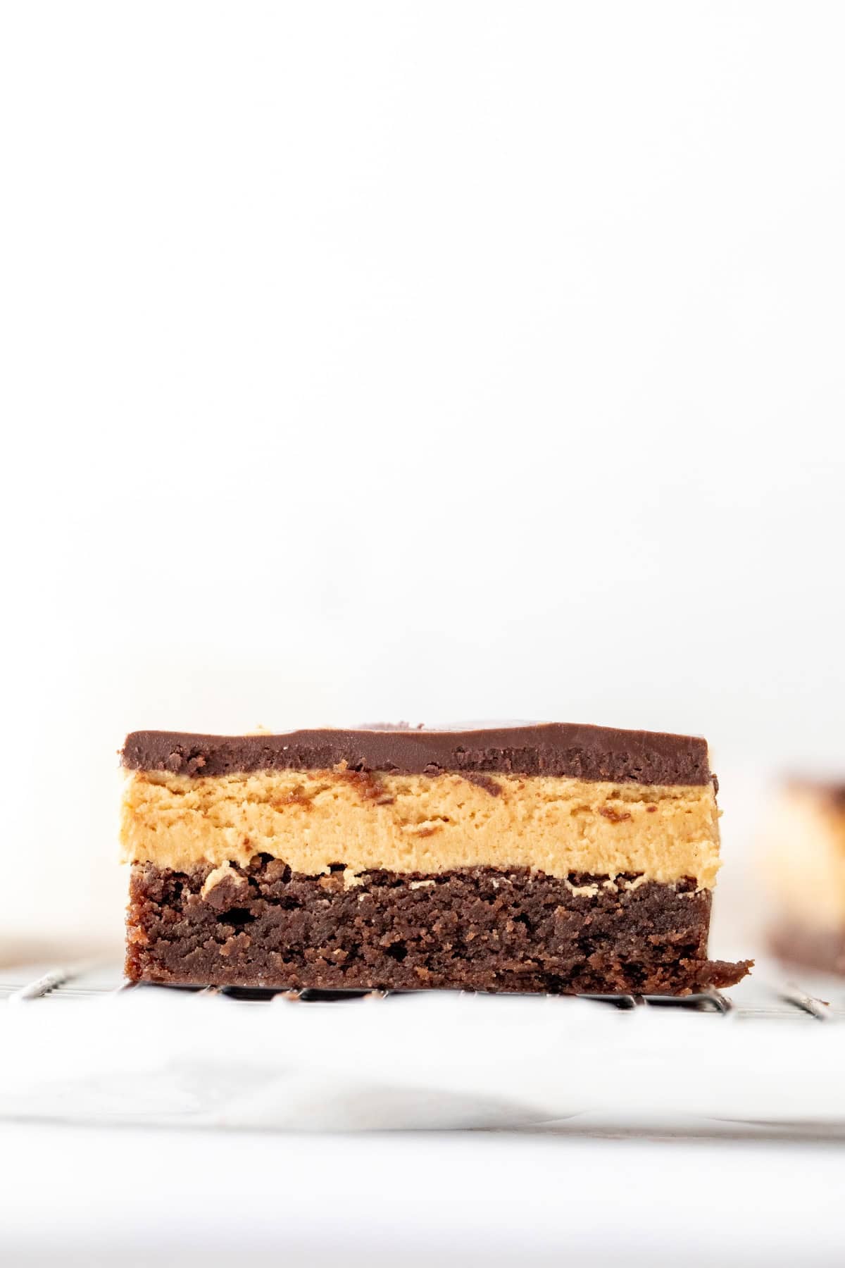 triple layer brownie with peanut butter fudge in the middle and chocolate on top