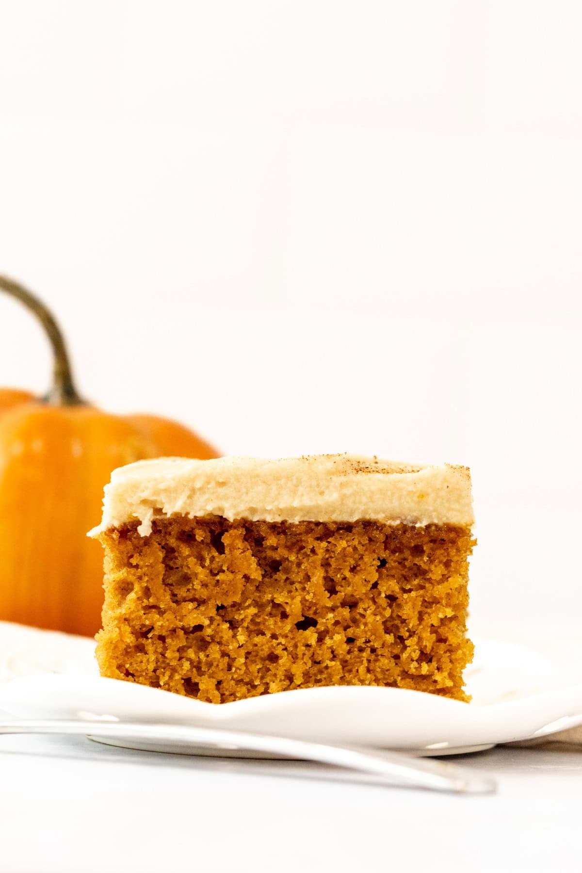 slice of pumpkin spice latte sheet cake with coffee frosting