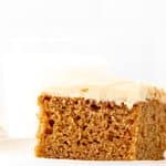 Slice of spice cake topped with cream cheese frosting