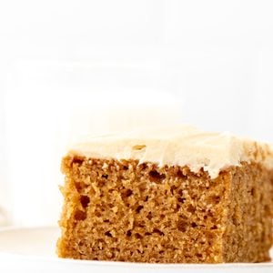 Slice of spice cake topped with cream cheese frosting