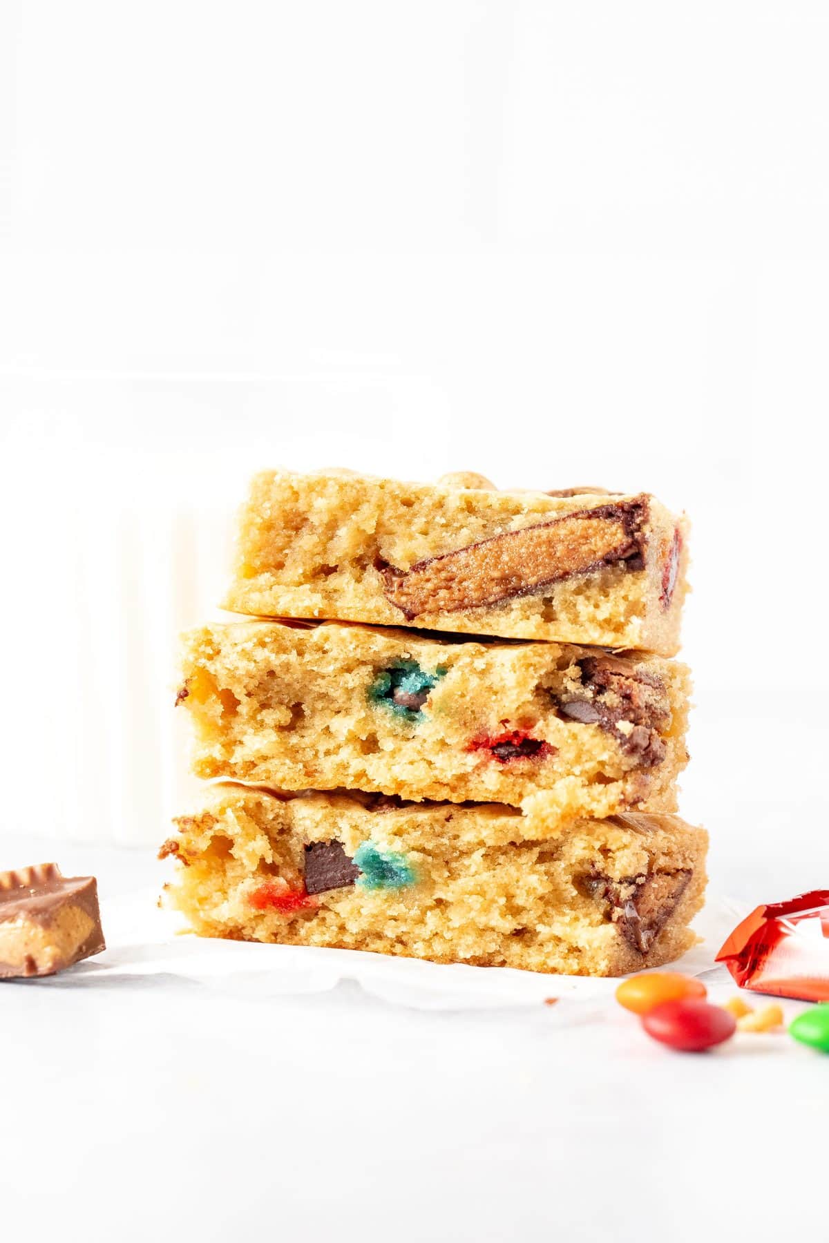 candy bar blondies broken in half and stacked on top of one another