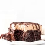 Triple chocolate poke cake with a bite taken out