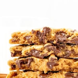 Stack of fall-spice chocolate chip cookies, broken in half